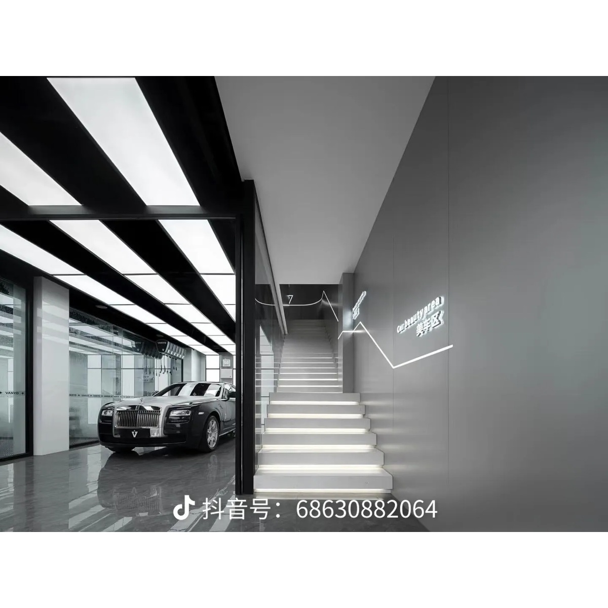 Showroom interior with metallic surfaces and linear lighting