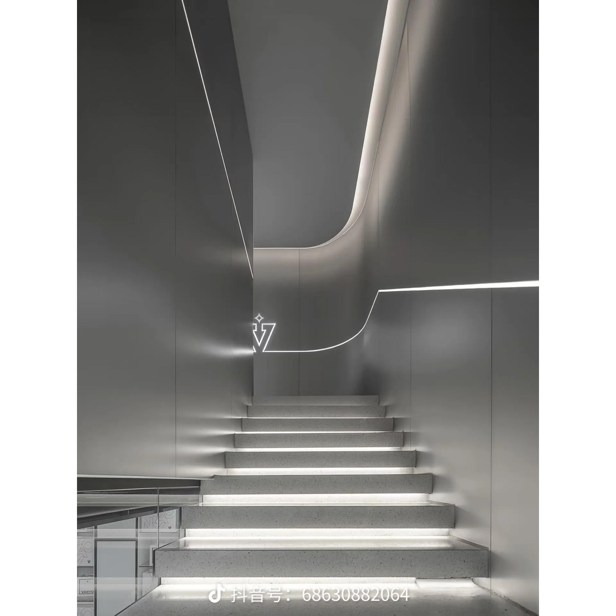 Stair interior with metallic wall surfaces and integrated lighting