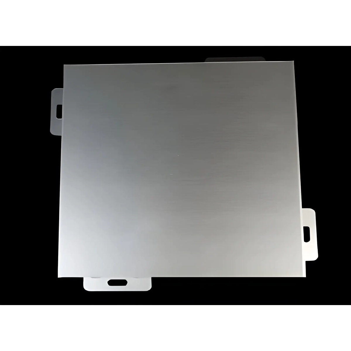Grey folded cladding panel with perimeter fixing tabs against a dark background