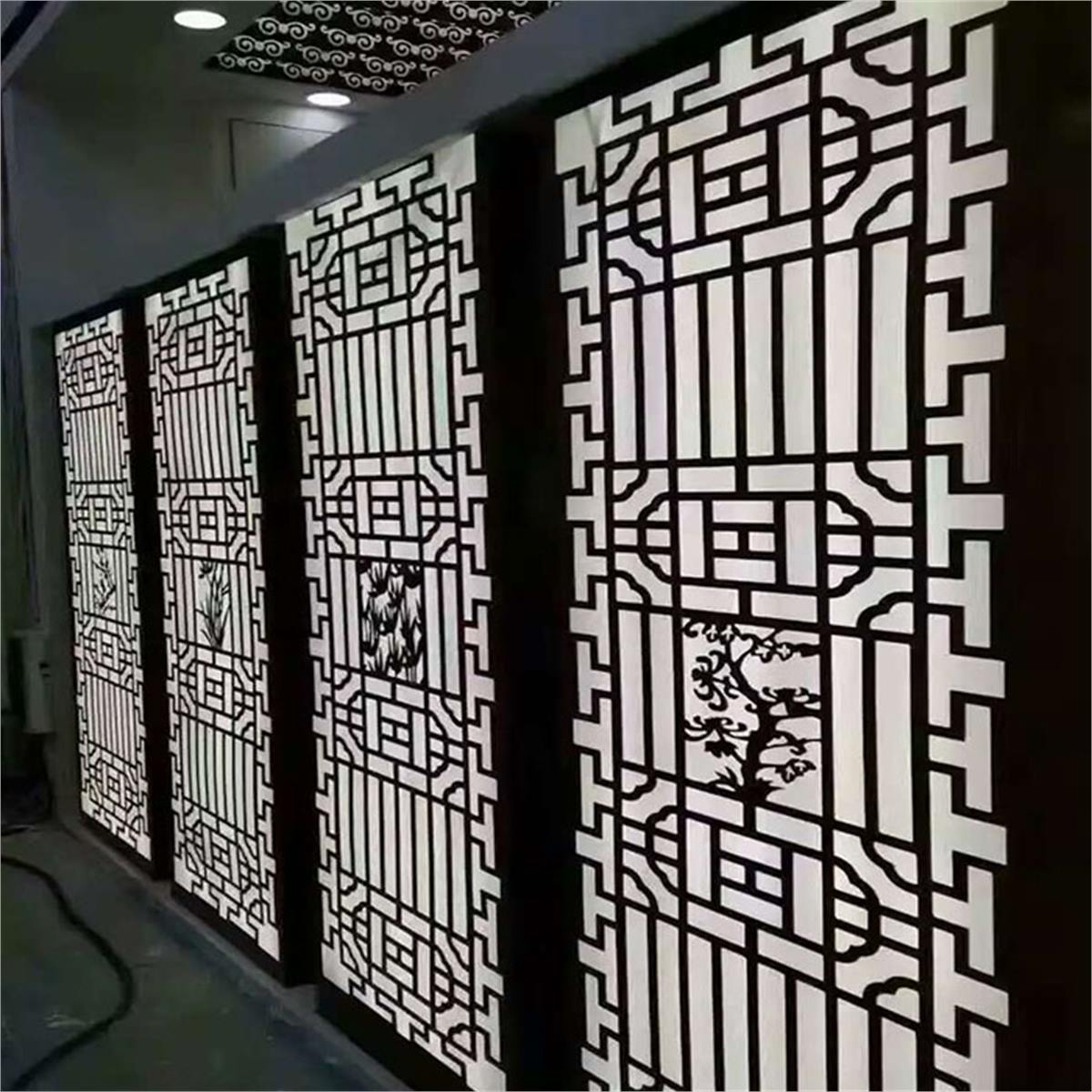 Decorative lattice screen panels with geometric borders and ornamental patterns