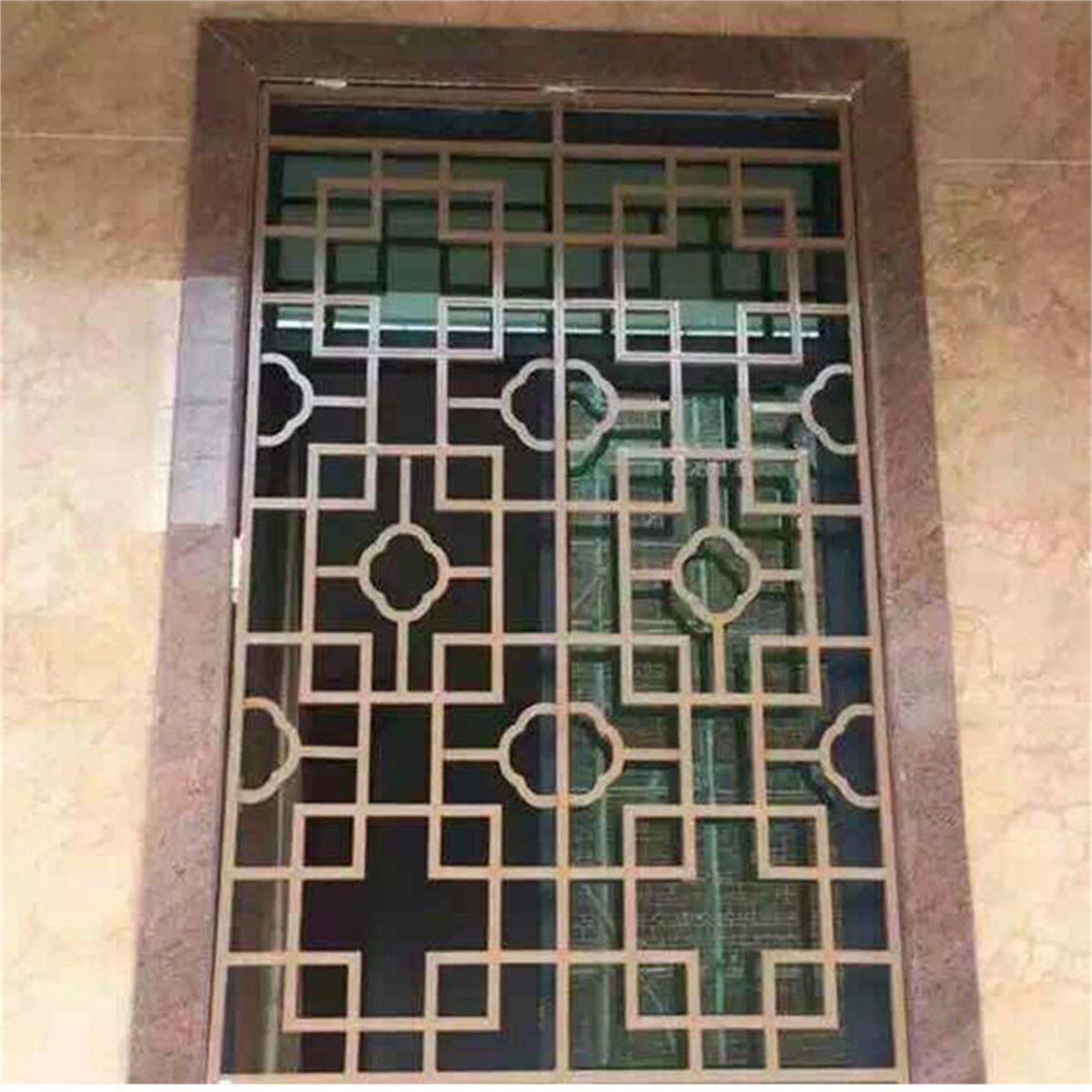 Decorative geometric grille fitted across a building window opening